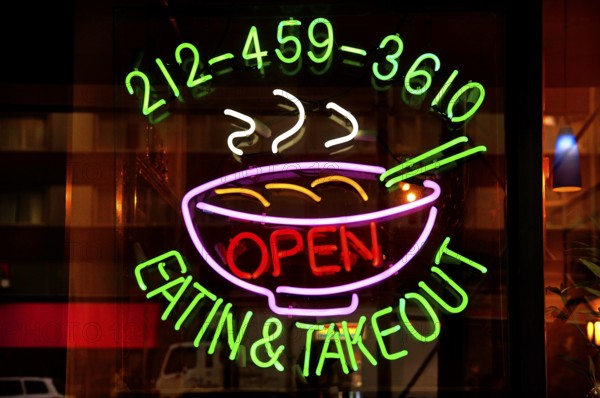 Illuminated advertising at a fast food restaurant, New York City, USA