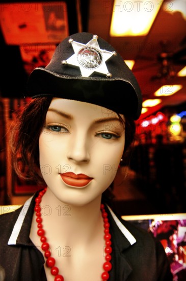 Female mannequin with sheriff's star on hat, New York City, USA