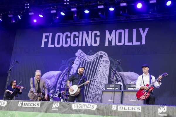 Bridget Regan (fiddle player), Dave King (singer), Robert Schmidt (banjo player) and Dennis Casey (guitarist) from Flogging Molly at the Highfield Festival on Sunday, Störmthaler See, 18.08.2024