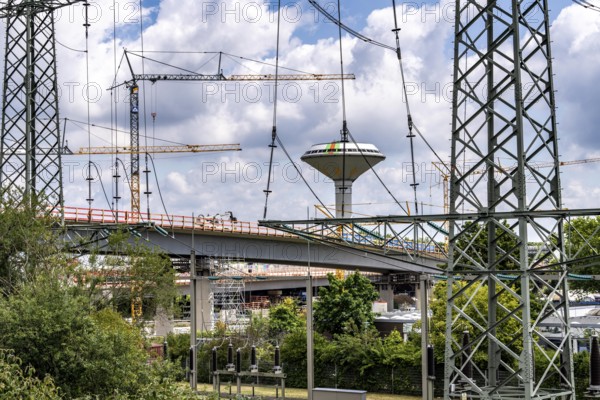 Motorway construction site at the Leverkusen-West junction, A1 and A59 motorways, new construction, reconstruction of the motorway junction due to the construction of the new Leverkusen Rhine Bridge, construction period until the end of 2027, Leverkusen water tower, North Rhine-Westphalia, Germany