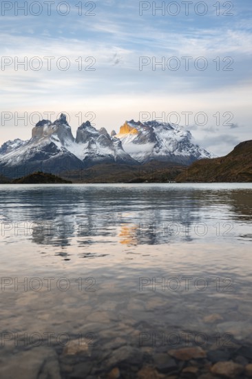 Cuernos del Paine mountain range at sunset, reflection in Lago Pehoe, Torres del Paine National Park, Chile