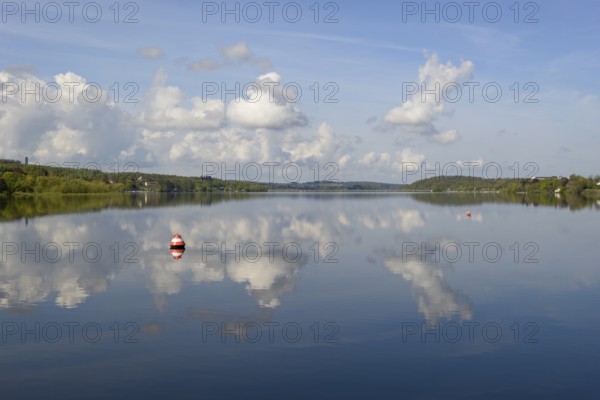 View over the Möhnesee, Möhnesee tower, red and white buoy, blue cloudy sky, reflection on the water surface, Möhnetalsperre, North Rhine-Westphalia, Germany