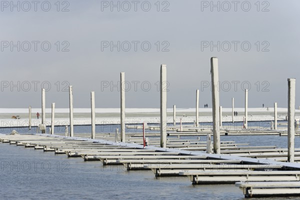 Winter day, onset of winter, snow on the jetties in the marina, North Sea, Norddeich, Lower Saxony, Germany
