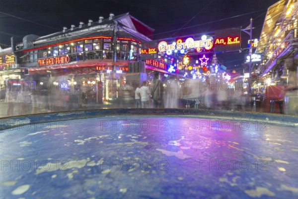 Neon lights, the legendary restaurant THE RED PIANO, Pub Street in the evening, entertainment district with bars and restaurants, Siem Reap, Cambodia