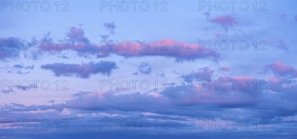Background image for sky replacement, evening sky with pink clouds at dusk after sunset