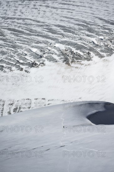 Mountaineer in the distance on the Übeltalferner glacier, Stubai Alps, South Tyrol, Italy