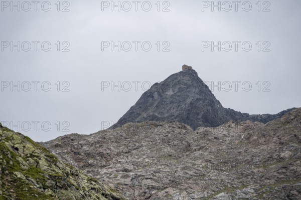 Becherhaus mountain hut on the rocky summit of the Becher, Stubai Alps, near Ridnaun, South Tyrol, Italy