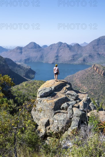 Hiker enjoying panorama, Blyde River Canyon with summit Three Rondawels, view of canyon with river Blyde River and table mountains, canyon landscape, Panorama Route, Mpumalanga, South Africa