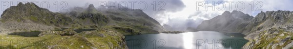 Mountain lakes Wangenitzsee and Kreuzsee, cloudy mountain peaks in the morning, Schober group, Hohe Tauern National Park, Carinthia, Austria