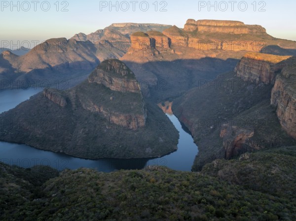 Sunset at Blyde River Canyon with Three Rondawels peak, view of canyon with Blyde River and table mountains in the evening light, canyon landscape, Panorama Route, Mpumalanga, South Africa
