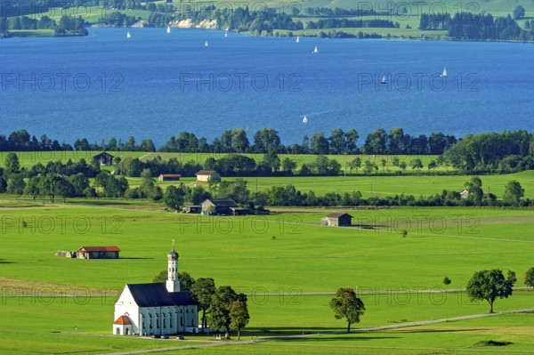 View from Neuschwanstein Castle to the pilgrimage church of St Coloman, Forggensee, Schwangau, Schwanengau plain, Königswinkel, Ostallgäu, Allgäu, Swabia, Bavaria, Germany