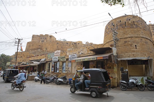 Street scene in the old town of Jaisalmer, the fortress in the background, Rajasthan, India