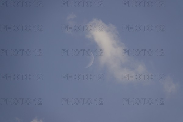 Sky in summer with clouds, moon, Germany