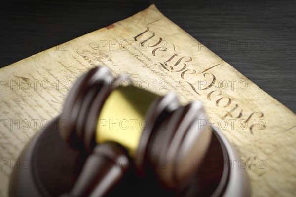 United states constitution and gavel resting on table