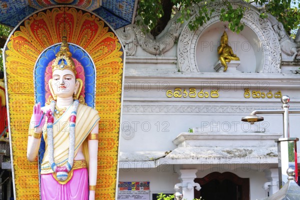 Buddha statue at the entrance of a temple, Colombo, Sri Lanka