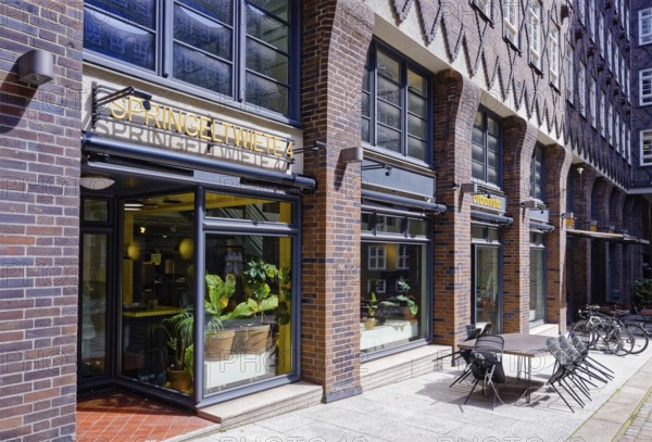 Shops in the Sprinkenhof. The Sprinkenhof is one of the office buildings that were erected in Hamburg's city centre at the beginning of the 20th century. Springeltwiete leads through the inner courtyard of the building. The Kontorhaus district was declared a UNESCO World Heritage Site in 2015. Hamburg, Germany