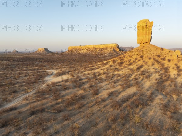 The Vingerklip (rock finger) and the Ugab Valley Terraces are surrounded by thornbush and mopane (Colophospermum mopane) savanna. Aerial view. Drone shot. Damaraland, Namibia