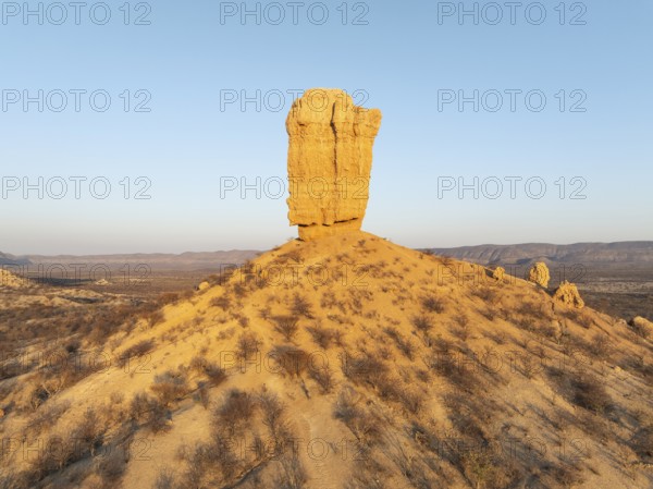 The Vingerklip (rock finger) is surrounded by thornbush and mopane (Colophospermum mopane) savanna. Aerial view. Drone shot. Damaraland, Namibia