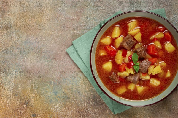 Meat goulash, with potatoes and carrots, sweet pepper, traditional Hungarian soup, homemade, no people