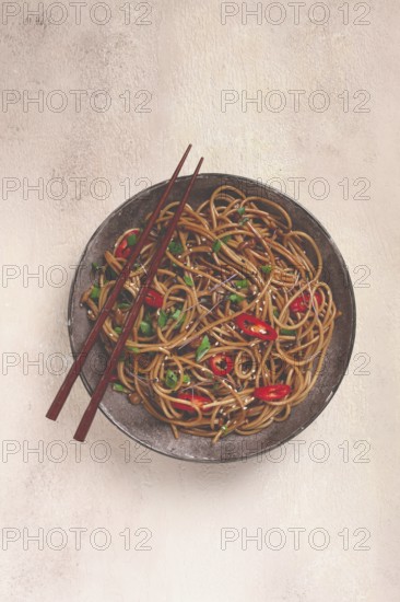 Udon noodles, with shimeji mushrooms, vegetables, in sauce, with sesame seeds, green onions, Asian vegetarian food, horizontal, without people