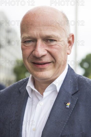 Kai Wegner (Governing Mayor of Berlin) with a Berlin bear pin in rainbow colours after raising the rainbow flag for Pride Week in front of the Rotes Rathaus in Berlin on 09.07.2025