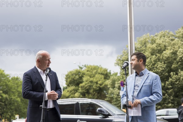 Kai Wegner (Governing Mayor of Berlin) and Florian Winkler-Schwarz, Managing Director of the Lesbian and Gay Association (LSVD) Berlin Brandenburg, give a speech in front of the raising of the rainbow flag for Pride Week in front of the Rotes Rathaus in Berlin on 9 July 2025
