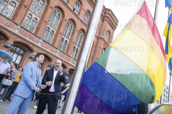 Florian Winkler-Schwarz, Managing Director of the Lesbian and Gay Federation (LSVD) Berlin Brandenburg and Kai Wegner (Governing Mayor of Berlin) at the raising of the rainbow flag for Pride Week in front of Berlin's Rotes Rathaus on 9 July 2025