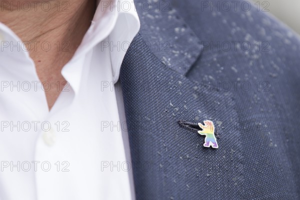 Berlin bear pin in rainbow colours on the jacket of Kai Wegner (Governing Mayor of Berlin) after raising the rainbow flag for Pride Week in front of the Rotes Rathaus in Berlin on 09.07.2025