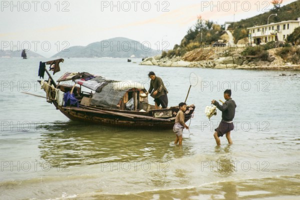 A family home living on a small sampan boat, Castle Peak, New Territories, Hong Kong, Asia, 1964