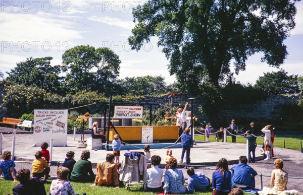 People watching parrot show in grounds of Dudley Zoo, West Midlands, England, UK 1970s