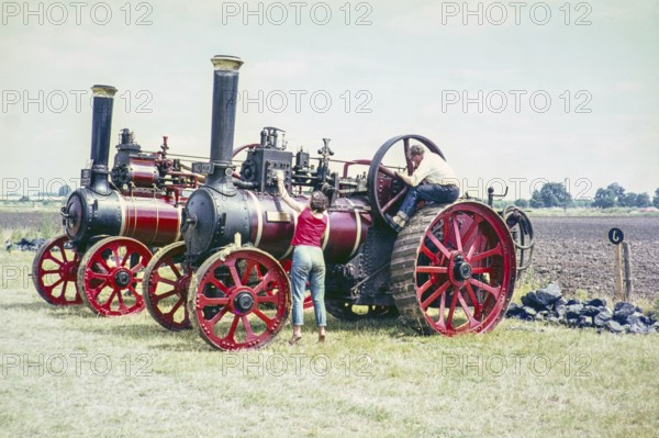 Steam traction engines, NO1213 is Princess Mary built 1920 by Marshall, DD2007 is Marshall General Purpose Engine built 1919, England, UK 1970s