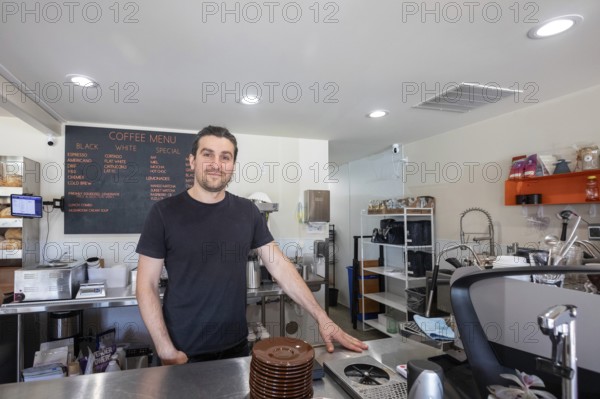 Midland, Michigan - Mohamed Miakiiev, one of the four Ukrainian refugees who own the popular Chef Sergey's Bakery. Several hundred thousand Ukrainians have been granted refugee status in the U.S. since Russia invaded their homeland, but the Trump Administration is considering whether to revoke their legal status. Miakiiev is from Crimea, which Russia has occupied since 2014