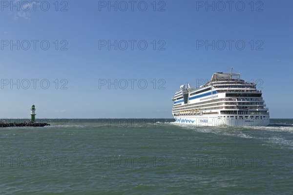 Cruise ship AIDA nova leaving, lighthouse, Warnow estuary, Warnemünde, Rostock, Mecklenburg-Western Pomerania, Germany