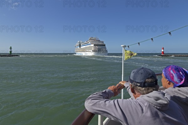 Cruise ship AIDA nova leaving, lighthouse, spectators, escort cruise, Warnow estuary, Warnemünde, Rostock, Mecklenburg-Western Pomerania, Germany