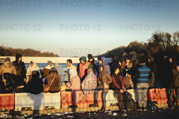 Refugees on the Inn bridge, Braunau am Inn, Austria, 20