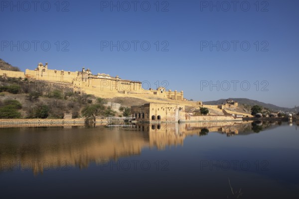 Amber Fort or fortress at Maota Lake on the Aravalli hill range, reflection in the water, Jaipur, Rajasthan, India