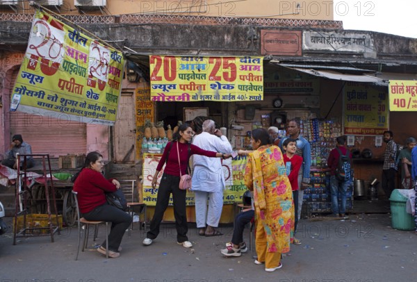 Street scene in front of a drink stall in the old city centre, Jaipur, Rajasthan, India