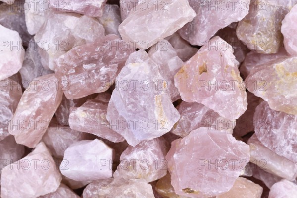 Close up of raw large rose quartz crystals. Natural pink gemstone chunks used for healing or decoration