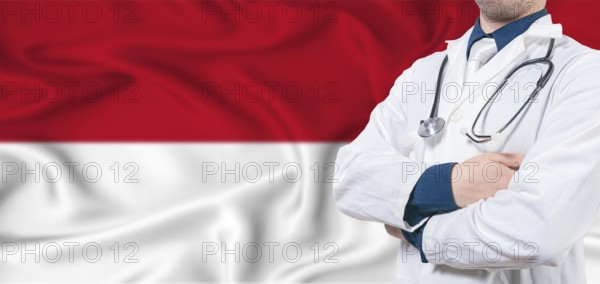Monaco healthcare concept. Male doctor on Monaco flag. Doctor with crossed arms on Monaco flag