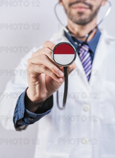 Monaco health and medical insurance concept. Monaco healthcare system, doctor holding stethoscope