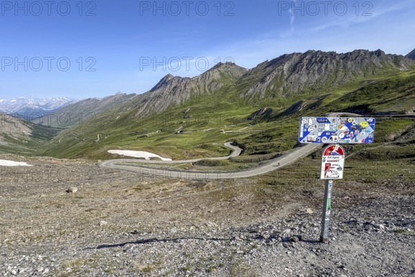 Panoramic view of northern ramp northern ascent mountain road alpine road to pass in Alps high Alps alpine pass above tree line, right sign pass marking of 2744 metre high Col d'Agnel, Colle dell'Agnello, ontgillarde, Molines-en-Queyras, Hautes-Alpes, France
