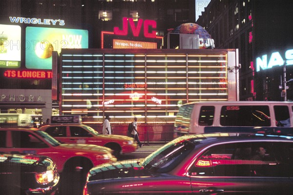 Street scene at night in Manhattan, New York City, USA