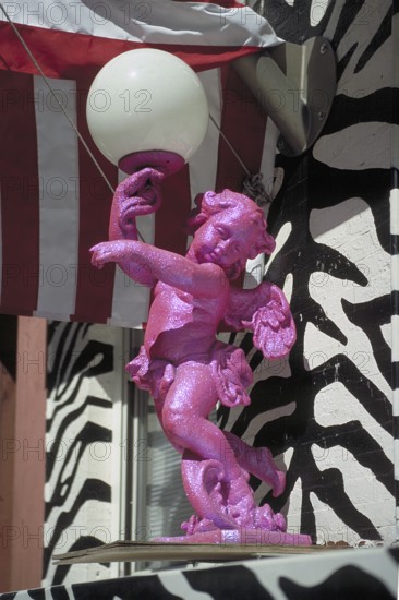 Angel as a lamp figure in front of a house entrance, New York City, USA