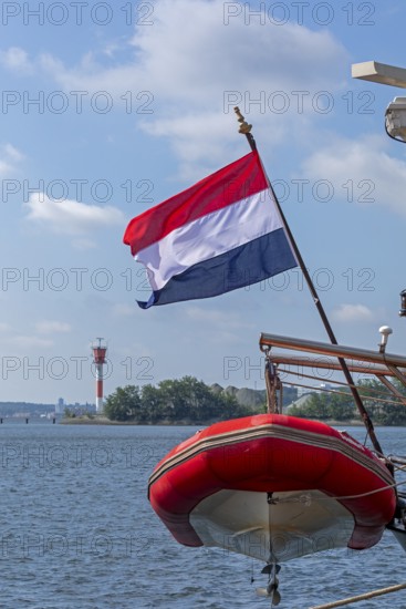Dutch flag, dinghy, sailing ship Elegant, lighthouse, Kieler Woche, Holtenau, Kiel, Schleswig-Holstein, Germany