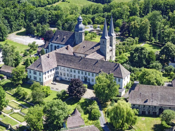 MarienmÃ¼nster Abbey is a former Benedictine monastery in the North Rhine-Westphalian town of MarienmÃ¼nster. The monastery was abolished in 1803 and is now a recognised place of pilgrimage. The former abbey church is the parish church of the parish of St James the Elder and is part of the MarienmÃ¼nster pastoral network in the Höxter deanery of the Archdiocese of Paderborn. Aerial view. MarienmÃ¼nster, North Rhine-Westphalia, Germany