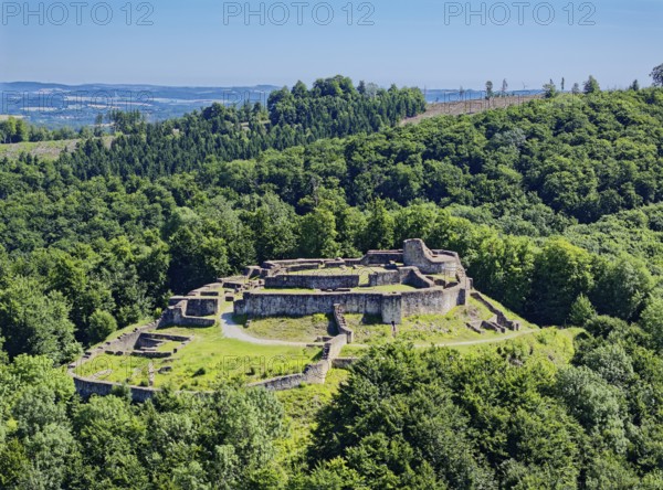 The Falkenburg ruins in the Teutoburg Forest are a castle ruin near the village of Berlebeck in the Detmold district. The former hilltop castle was built from around 1190. Aerial view. Berlebeck, North Rhine-Westphalia, Germany