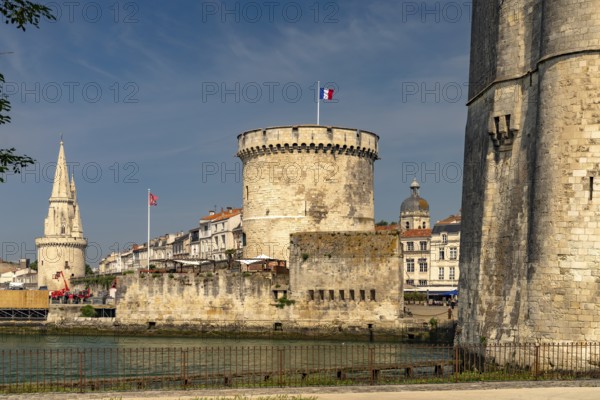 Harbour entrance to the old Vieux Port with the medieval towers Tour St.-Nicolas, Tour de la Lanterne and Tour de la Chaine, La Rochelle, France