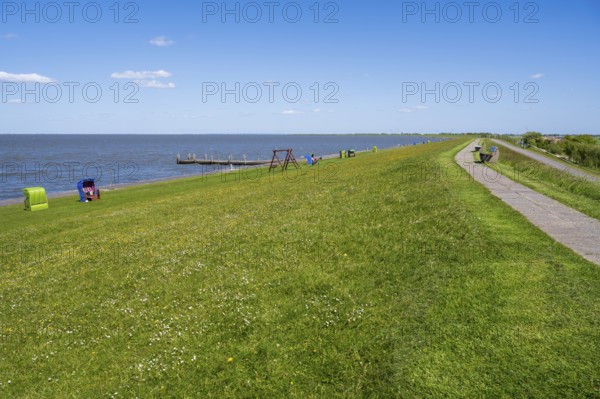 Beach chairs on the dyke, Pellworm Island, North Frisia, North Sea, Schleswig-Holstein, Germany
