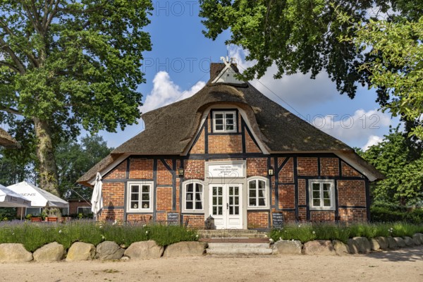 Half-timbered farmhouse with restaurant and café on the Prinzeninsel in the GroÃŸer Plöner See near Plön, Schleswig-Holstein, Germany