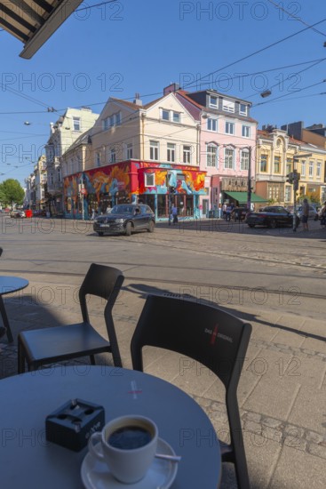 Ostertorsteinweg shopping street in the Ostertor district, car traffic, tram tracks, bicycles, wide footpath, many shops, café, coffee cup, popular residential area, graffiti, eastern suburbs, car traffic, cobblestones, Wilhelminian style buildings, facades, Bremen, Germany